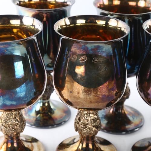 1453 - A set of 8 Elizabeth II silver goblets, flared rim with grapevine stem and gilt interior, by Barrowc... 