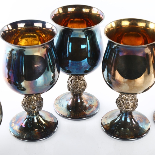 1453 - A set of 8 Elizabeth II silver goblets, flared rim with grapevine stem and gilt interior, by Barrowc... 