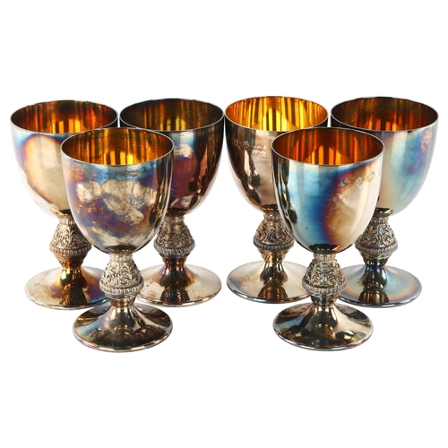 1454 - A set of 6 Elizabeth II silver goblets, plain form with relief foliate stem and gilt interior, by Ba... 