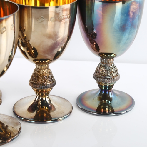 1454 - A set of 6 Elizabeth II silver goblets, plain form with relief foliate stem and gilt interior, by Ba... 