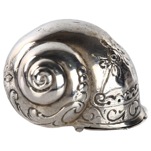 1457 - A Continental novelty silver snail-shell tobacco box, relief embossed floral decoration, length 4cm