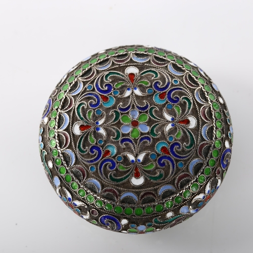 1461 - A Russian silver and champleve enamel circular pillbox, allover floral wirework decoration with gilt... 