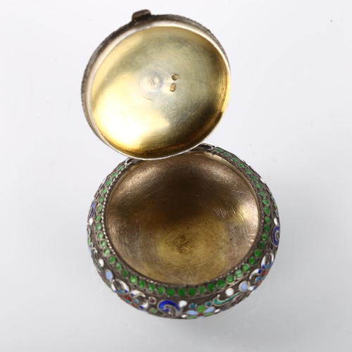 1461 - A Russian silver and champleve enamel circular pillbox, allover floral wirework decoration with gilt... 