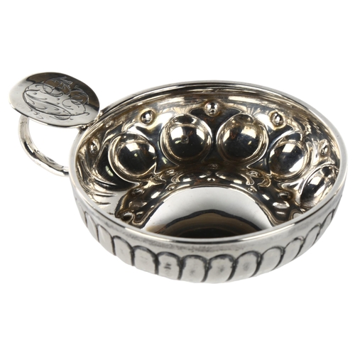 1463 - A French silver wine taster, half fluted decoration, bowl diameter 8cm, 2.1oz