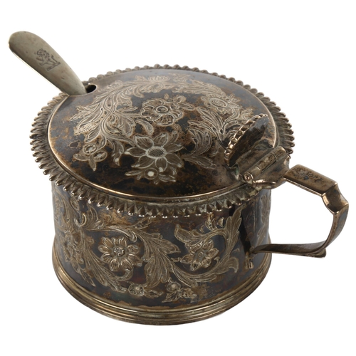 1464 - A William IV silver drum mustard pot, engraved floral decoration with gadrooned rim and shell thumbp... 