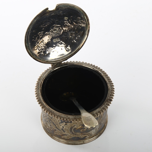 1464 - A William IV silver drum mustard pot, engraved floral decoration with gadrooned rim and shell thumbp... 