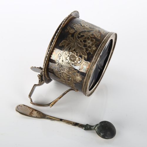 1464 - A William IV silver drum mustard pot, engraved floral decoration with gadrooned rim and shell thumbp... 