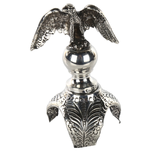 1467 - JUDAICA - an early 20th century silver rimonim/Torah scroll finial, with eagle knop and relief embos... 