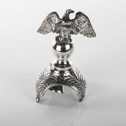 1467 - JUDAICA - an early 20th century silver rimonim/Torah scroll finial, with eagle knop and relief embos... 