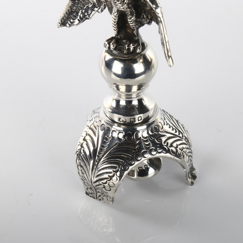 1467 - JUDAICA - an early 20th century silver rimonim/Torah scroll finial, with eagle knop and relief embos... 