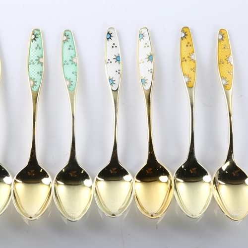 1475 - FRIGAST - a set of 8 Danish vermeil sterling silver and harlequin enamel coffee spoons, with sun des... 