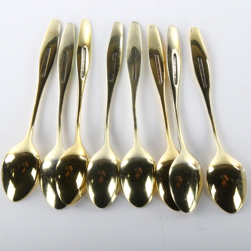 1475 - FRIGAST - a set of 8 Danish vermeil sterling silver and harlequin enamel coffee spoons, with sun des... 