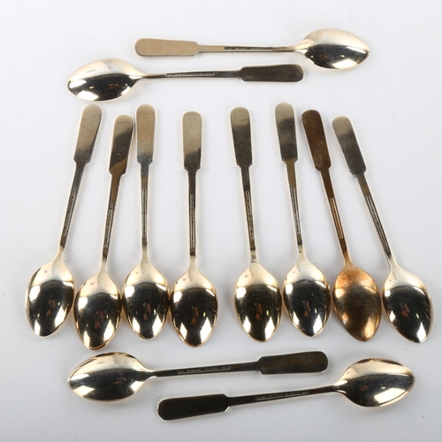 1478 - EGON LAURIDSEN - a set of 12 Danish vermeil sterling silver and red enamel coffee spoons, with shamr... 