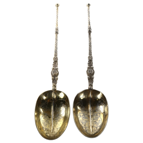 1481 - A large pair of George V silver anointing spoons, gilded and engraved bowls, by Wakely & Wheeler, ha... 