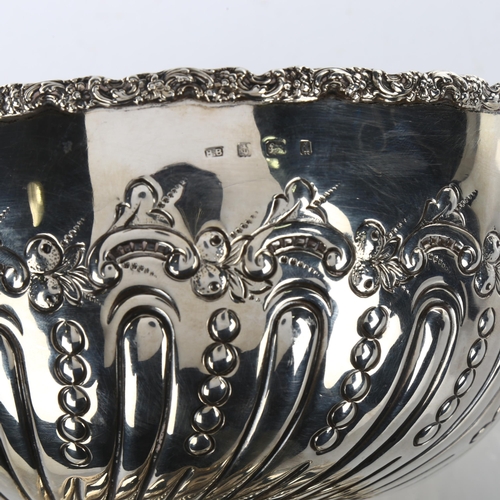 1490 - An Edwardian silver pedestal rose bowl, relief embossed foliate and half-fluted decoration, by Henry... 