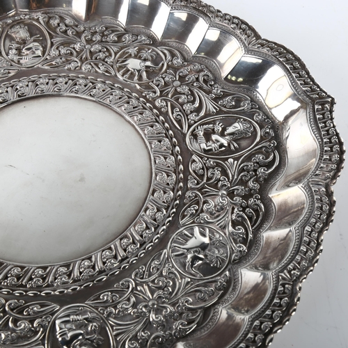 1491 - A large early 20th century Sri Lankan silver presentation salver, circular lobed form with applied f... 