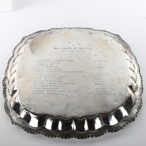 1491 - A large early 20th century Sri Lankan silver presentation salver, circular lobed form with applied f... 