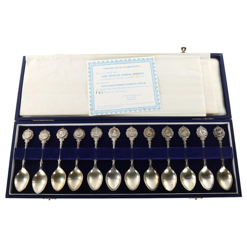 1492 - A set of 12 Elizabeth II silver Zodiac teaspoons, sculpted by David Cornell, by John Pinches Ltd, ha... 