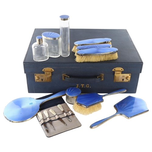 1494 - An Art Deco George V silver and blue enamel 10-piece travelling vanity set, in blue leather-covered ... 