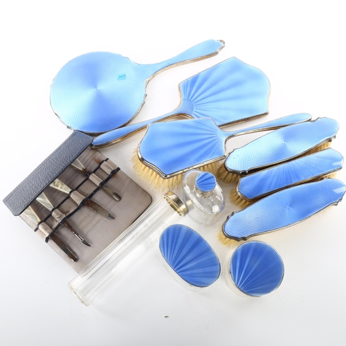 1494 - An Art Deco George V silver and blue enamel 10-piece travelling vanity set, in blue leather-covered ... 