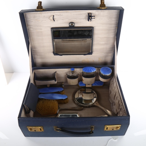 1494 - An Art Deco George V silver and blue enamel 10-piece travelling vanity set, in blue leather-covered ... 