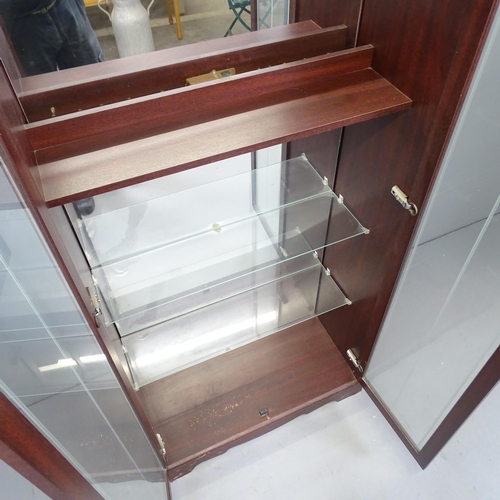 2518 - A reproduction mahogany veneered mirror back display cabinet with two glazed doors. 77x181x33cm.