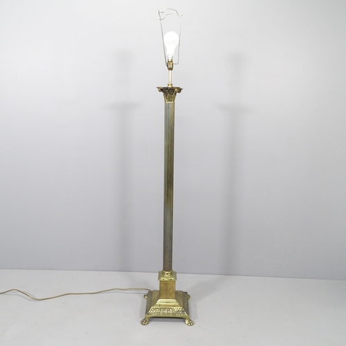 2022 - A 19th Century brass Corinthian column standard lamp on pedestal base. Height to bayonet 138cm.