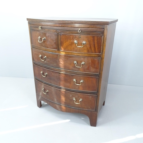 2023 - A Georgian mahogany bow front bachelor's chest of two short and three long drawers, with brushing sl... 