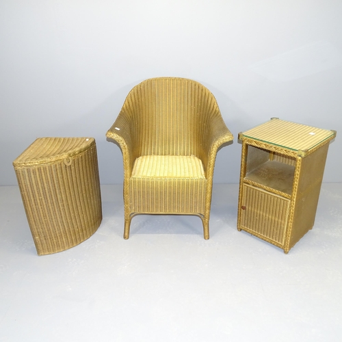 2502 - A Lloyd Loom Lusty lounge chair, a matching corner laundry basket and a bedside table (3)