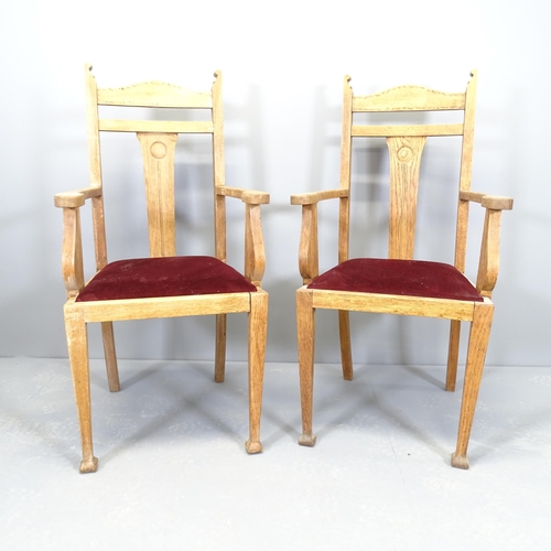 2505 - A pair of oak Arts & Crafts style open arm chairs with drop-in seats.