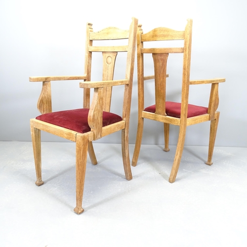 2505 - A pair of oak Arts & Crafts style open arm chairs with drop-in seats.