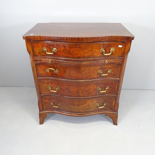 2509 - A Victorian mahogany and walnut serpentine-front chest of four long drawers, circa 1900, with brushi... 