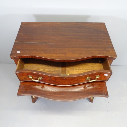 2509 - A Victorian mahogany and walnut serpentine-front chest of four long drawers, circa 1900, with brushi... 