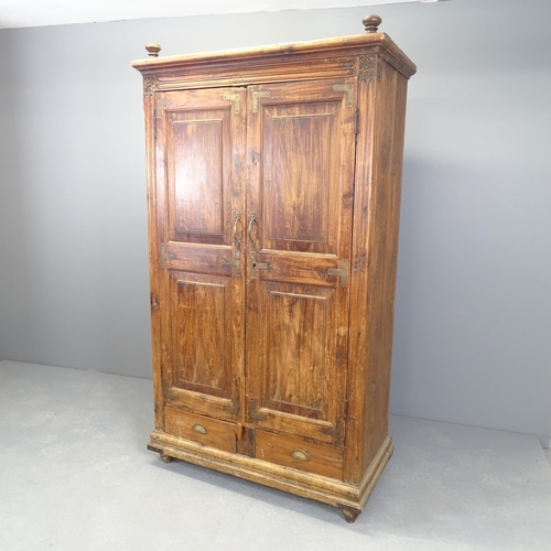 2511 - An Indian hardwood two-door wardrobe with shelf fitted interior and two frieze drawers to base. 100x... 