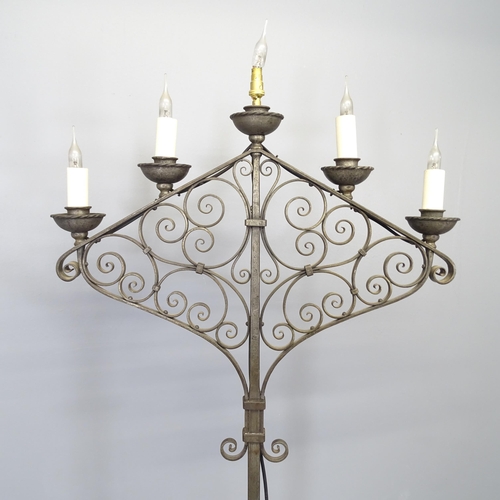 2520 - A wrought metal electric five light candelabra. Height 168cm.