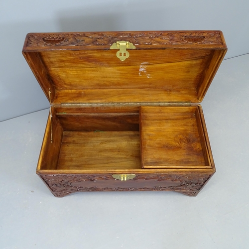 2528 - A Chinese camphorwood blanket box, with carved decoration. 80x45x39cm