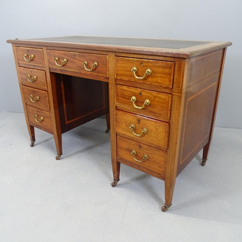 2529 - A 19th Century crossbanded mahogany and satinwood strung kneehole writing desk, with inset leather s... 