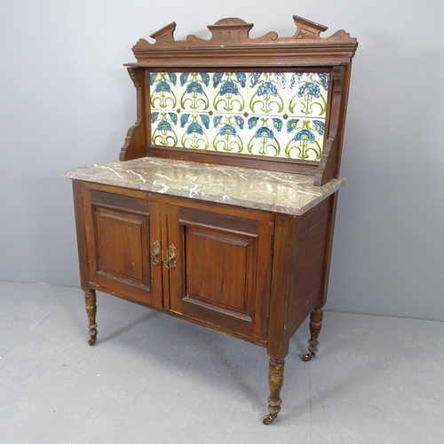 2530 - A Victorian Art Nouveau mahogany marble topped washstand, with raised tiled back and cupboards under... 