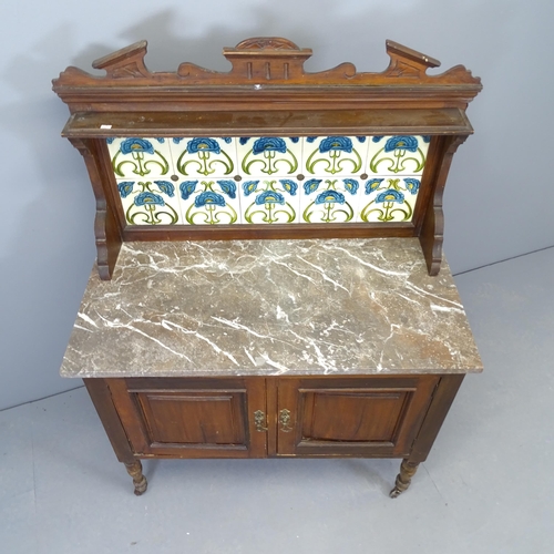 2530 - A Victorian Art Nouveau mahogany marble topped washstand, with raised tiled back and cupboards under... 