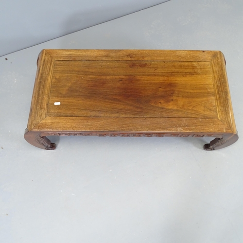 2531 - A Chinese elm opium table, with carved decoration. 101x33x42cm.