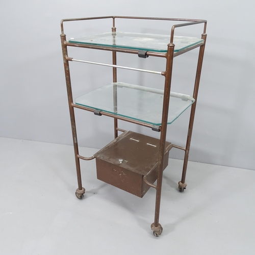 2248 - A mid-century chrome and glass medical trolley by Scholl. 49x87x38cm