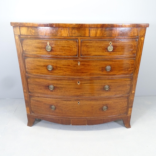 2534 - A George III crossbanded flame mahogany and satinwood and ebony strung bow front chest of two short ... 