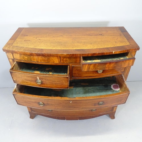 2534 - A George III crossbanded flame mahogany and satinwood and ebony strung bow front chest of two short ... 