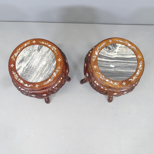 2537 - A pair of Chinese hardwood marble topped plant stands, with carved and mother of pear inlaid decorat... 