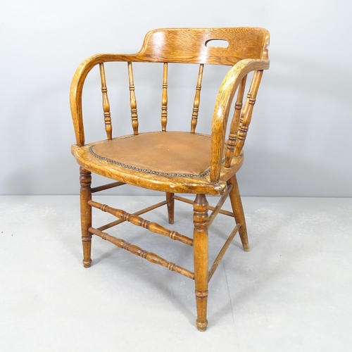 2547 - An early 20th century oak and elm bow-arm desk chair.