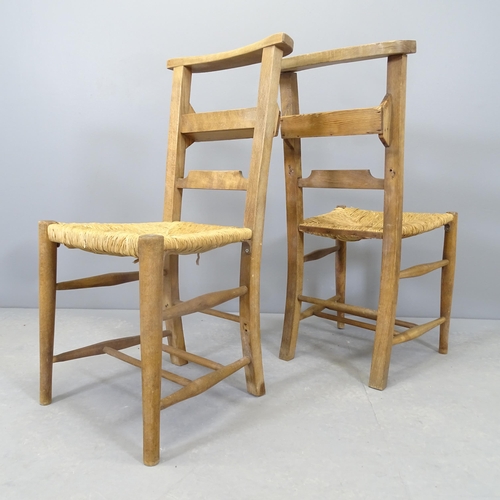 2561 - A pair of rush seated chapel chairs.