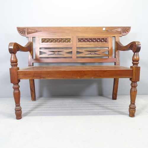 2565 - An Anglo-Indian colonial style teak bench. 140x93x60cm