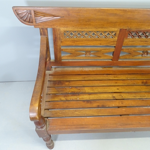 2565 - An Anglo-Indian colonial style teak bench. 140x93x60cm