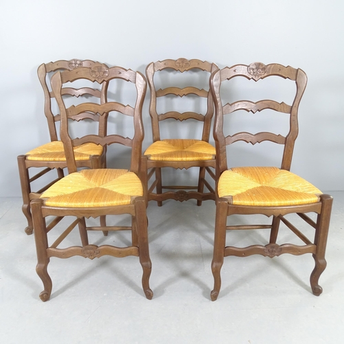 2581 - A set of four French oak rush-seated ladderback dining chairs.