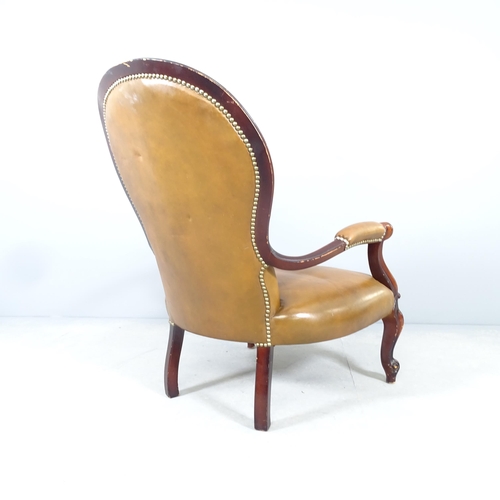 2584 - A reproduction mahogany and faux-leather upholstered low armchair.